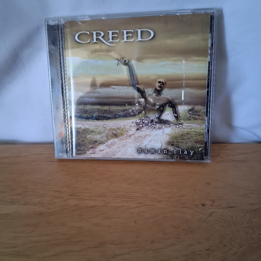Creed Human Clay CD with Brown and Gray Cover